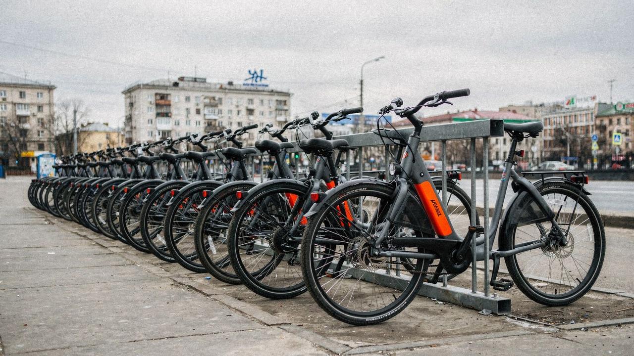 Electric bikes parked in a row at a rental rack in central Kyiv